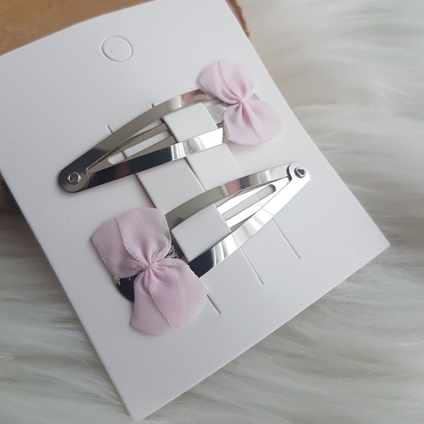 Hair clips with pink bows