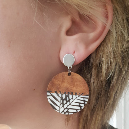 Stud earrings with resin charms with leaf pattern