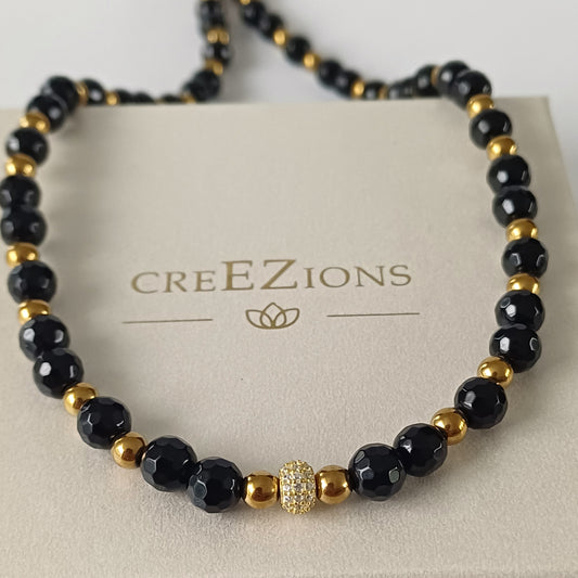 Ketting met facetgeslepen onyx, hematiet en pavé kraal