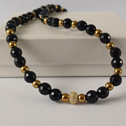 Ketting met facetgeslepen onyx, hematiet en pavé kraal