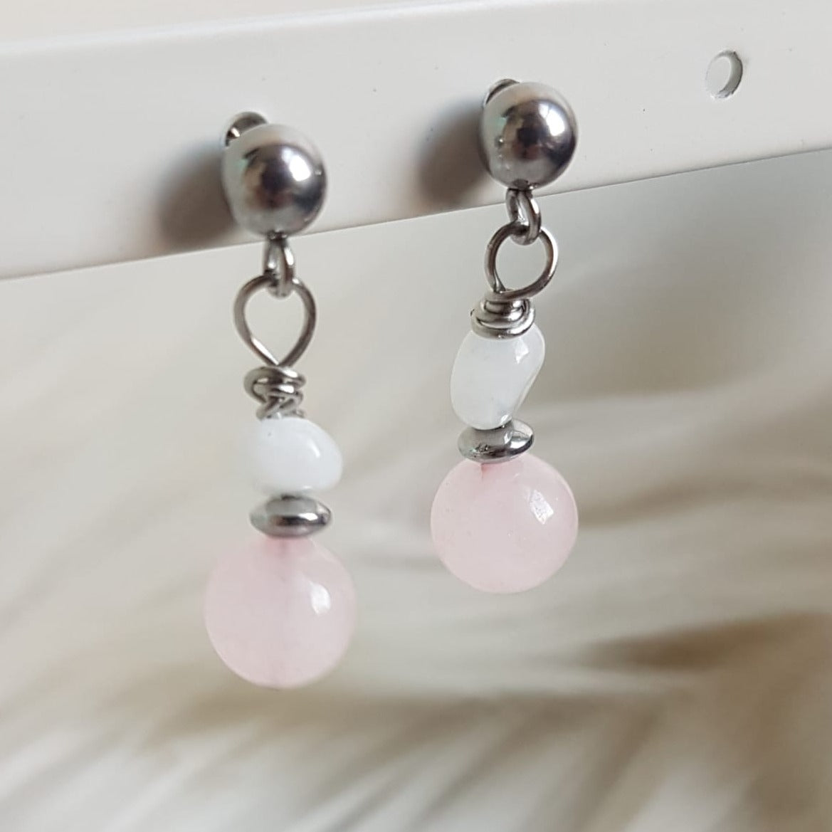 Stud earrings with rose quartz and moonstone charms