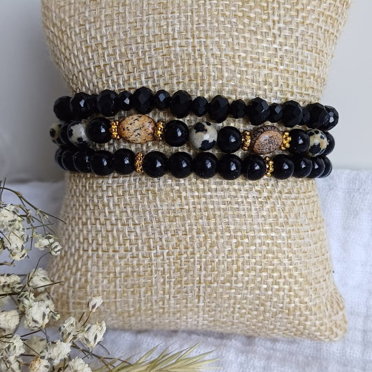 Set of bracelets in black and brown with star charm