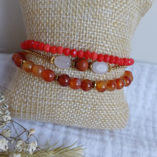 Set of bracelets in orange pink, beige and red