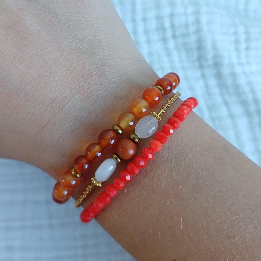 Set of bracelets in orange pink, beige and red