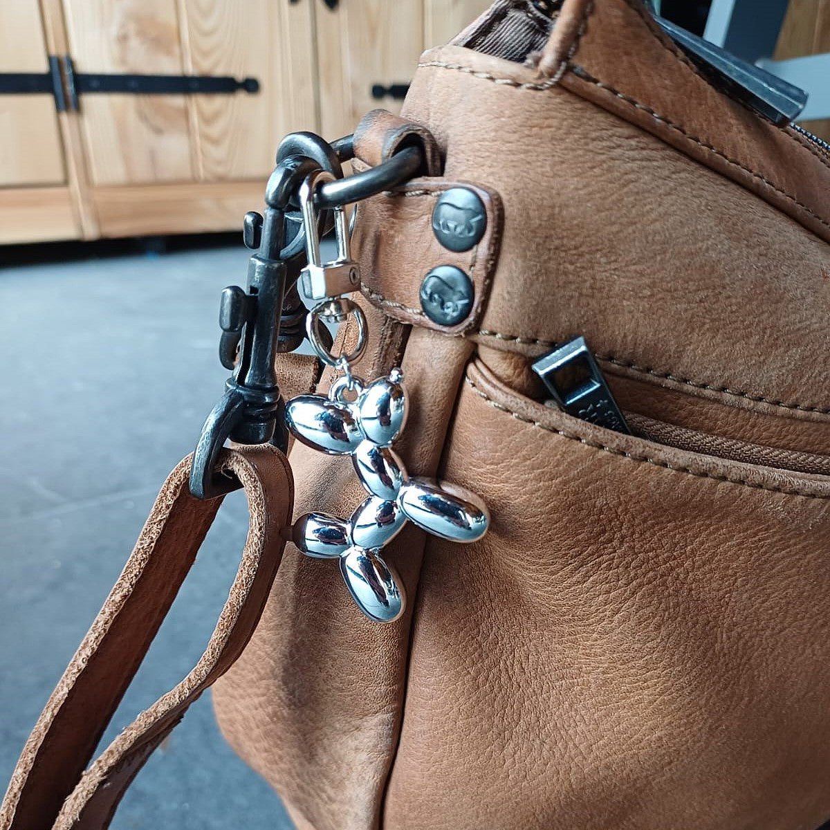 Sleutel/tassenhanger met ballon hondje