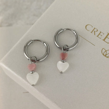 RVS oorbellen met hartjes van Rhodoniet en schelp